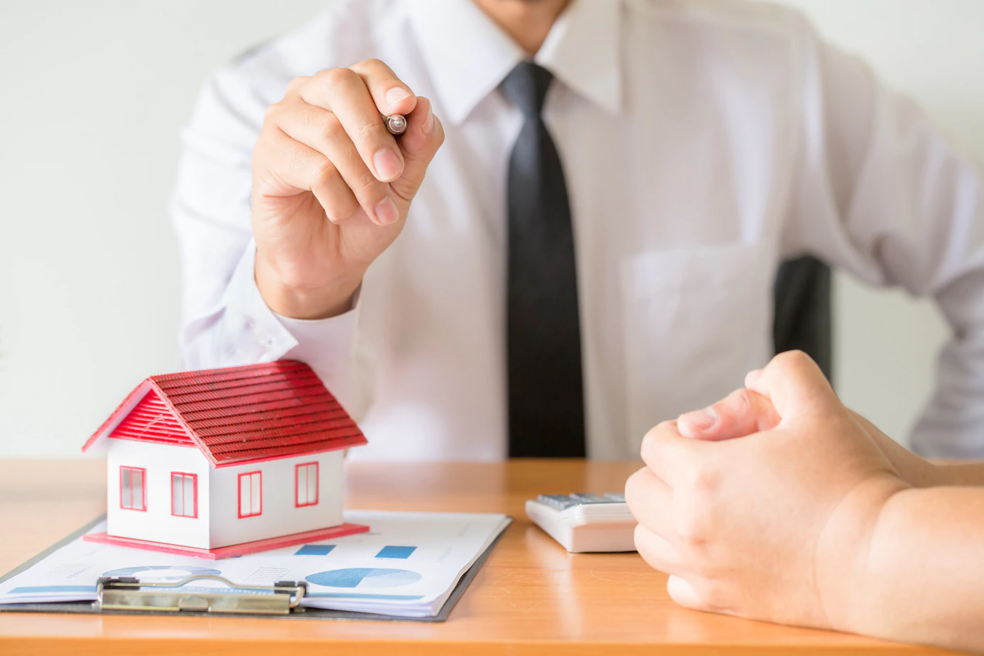 home-salesman-stretches-holding-black-pen_1150-14909